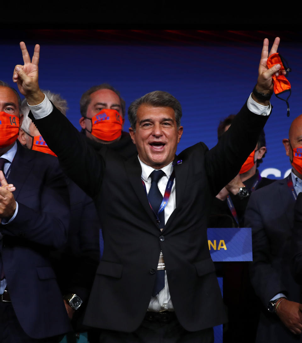 Joan Laporta celebrates his victory after elections at the Camp Nou stadium in Barcelona, Spain, Sunday, March 7, 2021. Joan Laporta has been elected Barcelona's president on Sunday, inheriting a club mired in debt and facing daunting problems that include the possible departure of Messi when his contract ends at the end of the season. (AP Photo/Joan Monfort)