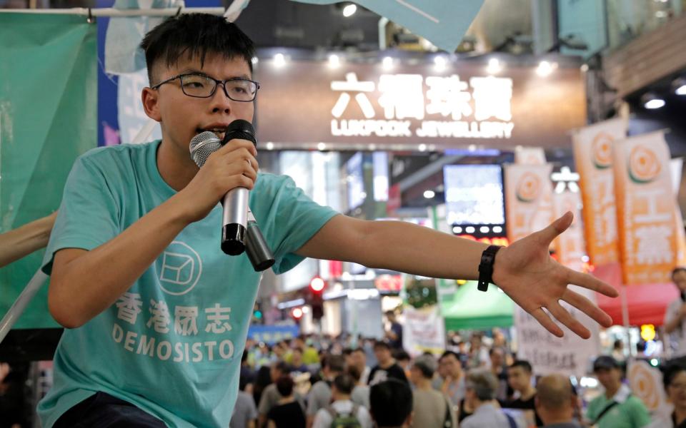 Some of the missing books include one written by prominent democracy advocate Joshua Wong - Kin Cheung/AP
