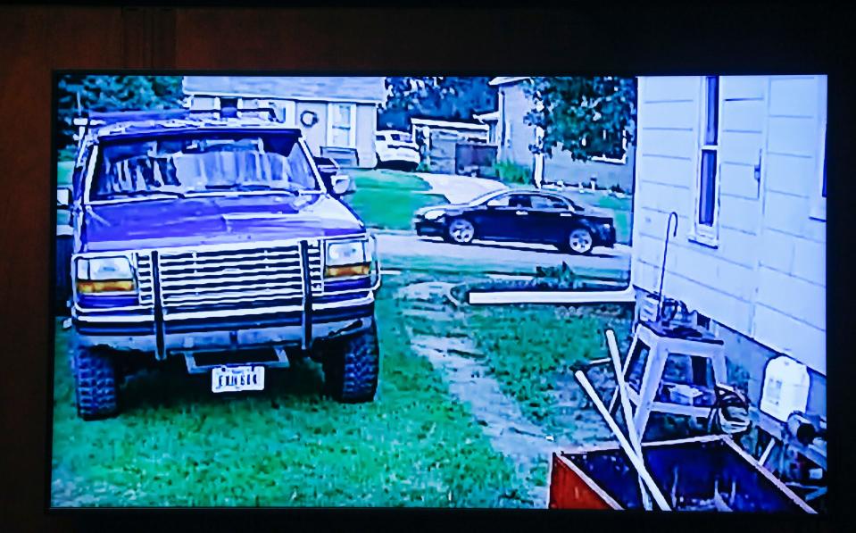 A still image, taken from a security camera video, of a black Chevy Malibu is shown in court during the trial of Cristhian Bahena Rivera at the Scott County Courthouse in Davenport, Iowa, on Thursday, May 20, 2021.