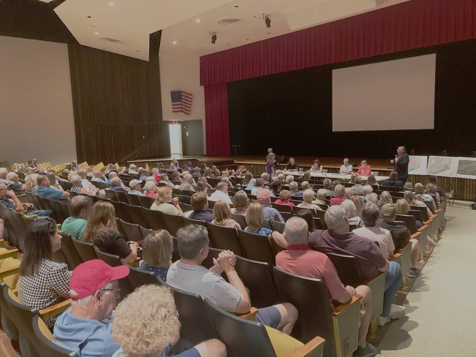Roughly 100 people attended a Girard Township meeting on Tuesday at the Girard High School auditorium to comment on a proposed business park in Girard and Fairview townships.