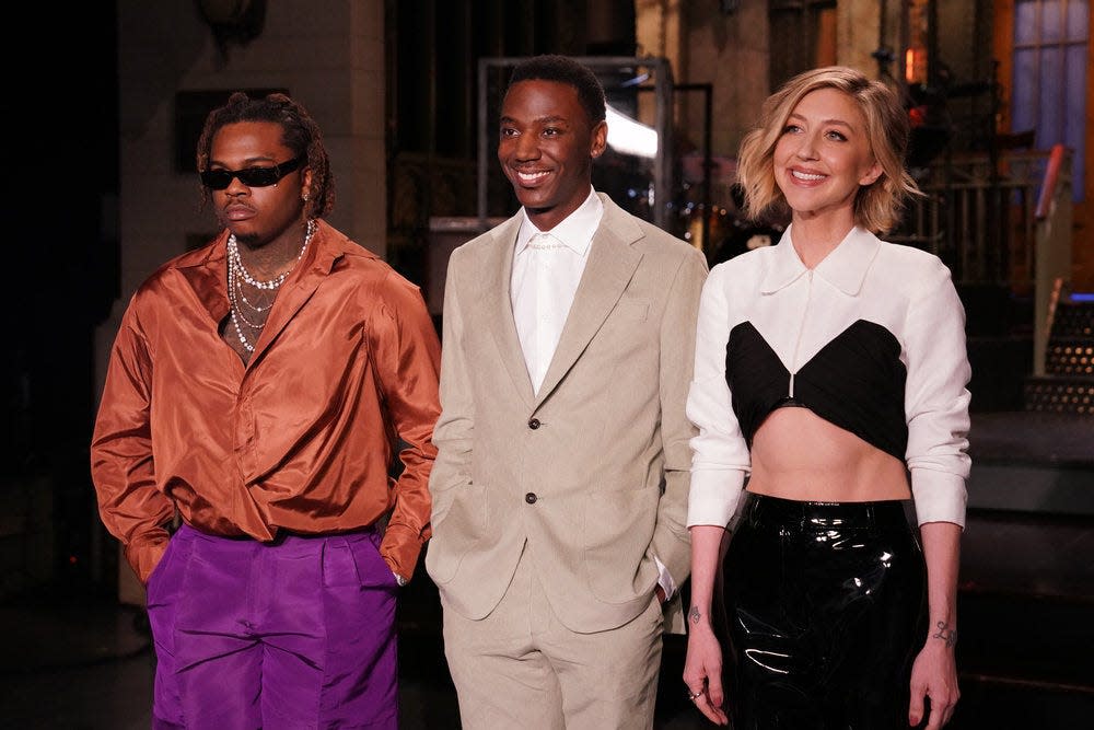 The April 2, 2022, episode of "Saturday Night Live" features comedian Jerrod Carmichael (center) as host and rapper Gunna (left) as musical guest. Also pictured: cast member Heidi Gardner (right).