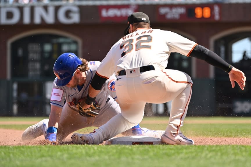 San Francisco Giants infielder David Villar (32) tags out New York Mets infielder Jeff McNeil (1) at third base during the fourth inning at Oracle Park.