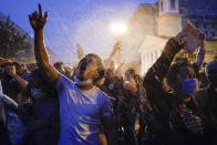 Demonstrators protest, Thursday, June 4, 2020, near the White House in Washington, over the death of George Floyd, a black man who was in police custody in Minneapolis. Floyd died after being restrained by Minneapolis police officers. (AP Photo/Evan Vucci)