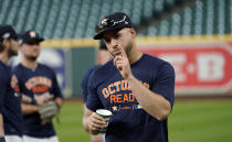 Houston Astros' George Springer points to a teammate during a baseball workout Thursday, Oct. 4, 2018, in Houston. The Astros play the Cleveland Indians in Game 1 of the American League Division Series Friday. (AP Photo/David J. Phillip)