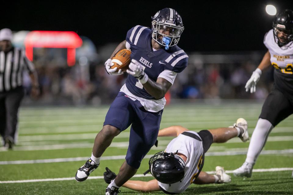 Effingham County's running back AJ Butts breaks a few tackles to gain positive yards.