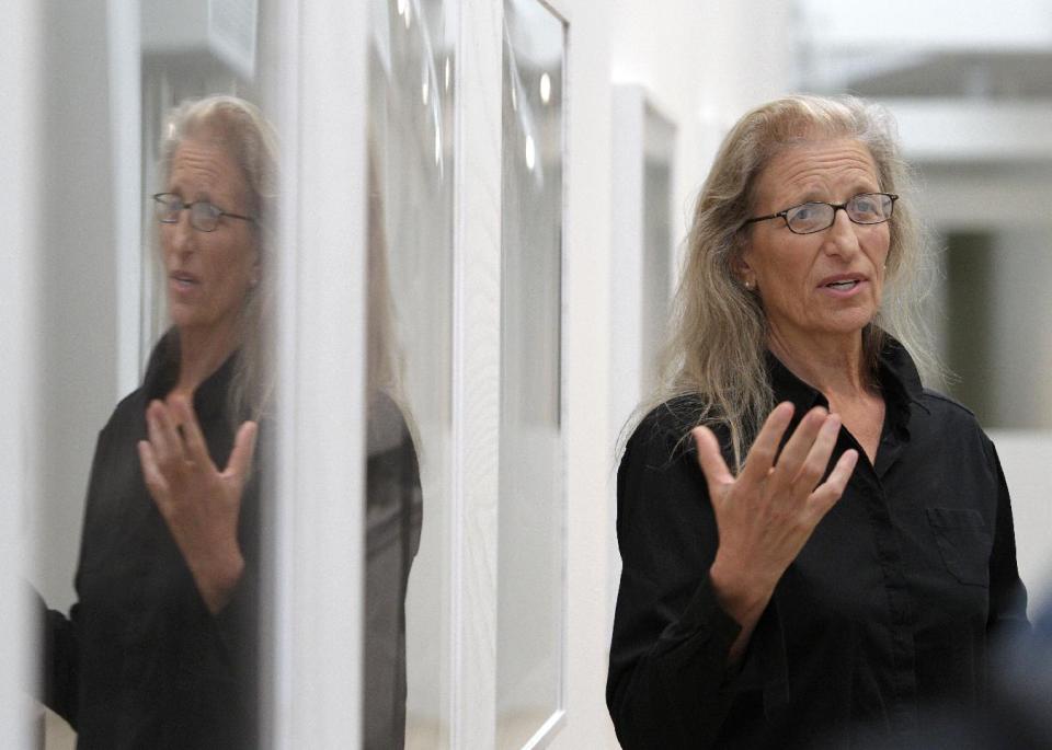 Annie Leibovitz talks about some of her work during a tour of her exhibition at the Wexner Center for the Arts Friday, Sept. 21, 2012, in Columbus, Ohio. Leibovitz's exhibition features work from her “Master Set,” an authoritative edition of 156 images. (AP Photo/Jay LaPrete)