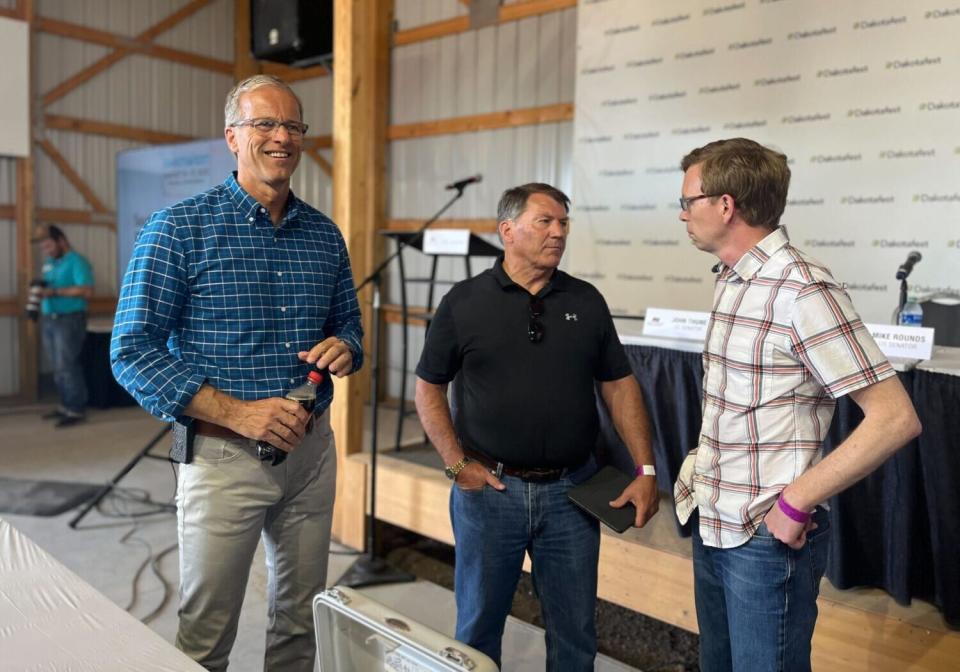 Sen. John Thune, Sen. Mike Rounds and Rep. Dusty Johnson attend a forum at Dakotafest in Mitchell on Aug. 16, 2023. (Joshua Haiar/South Dakota Searchlight)