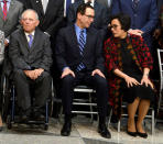 U.S. Treasury Secretary Steven Mnuchin (C) chats with Indonesia's Finance Minister Sri Mulyani Indrawati as German Finance Minister Wolfgang Schauble takes his seat for a "family" photo for the International Monetary and Financial Committee (IMFC), as part of the IMF and World Bank's 2017 Annual Spring Meetings, in Washington, U.S., April 22, 2017. REUTERS/Mike Theiler