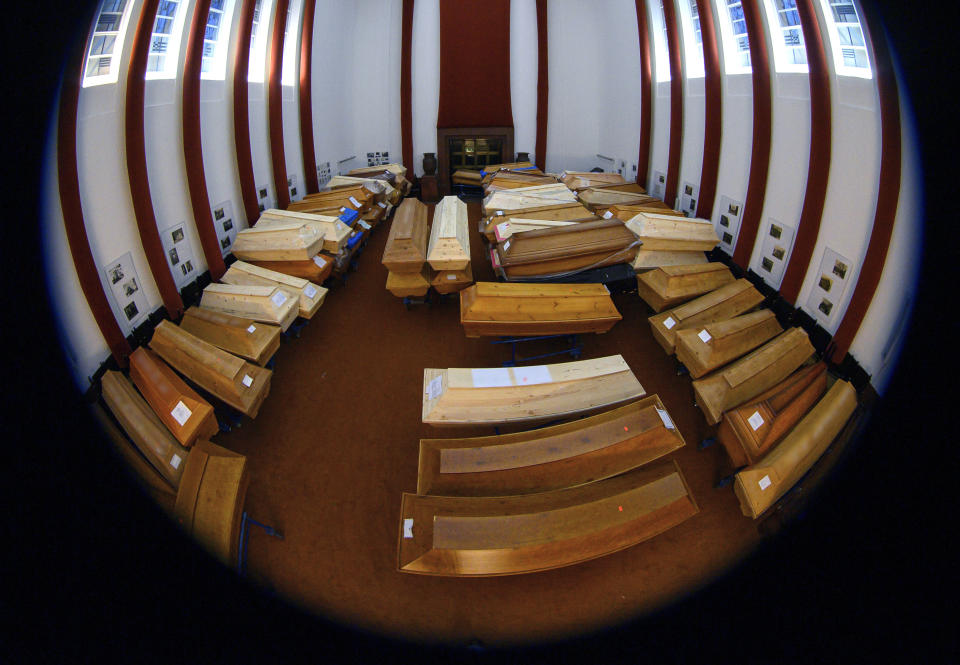 Coffins containing the deceased stand in the crematorium's worship room before cremation in Meissen, Germany, Friday, Jan.8, 2021. Most of them have died of or with the coronavirus. (Robert Michael/dpa via AP)