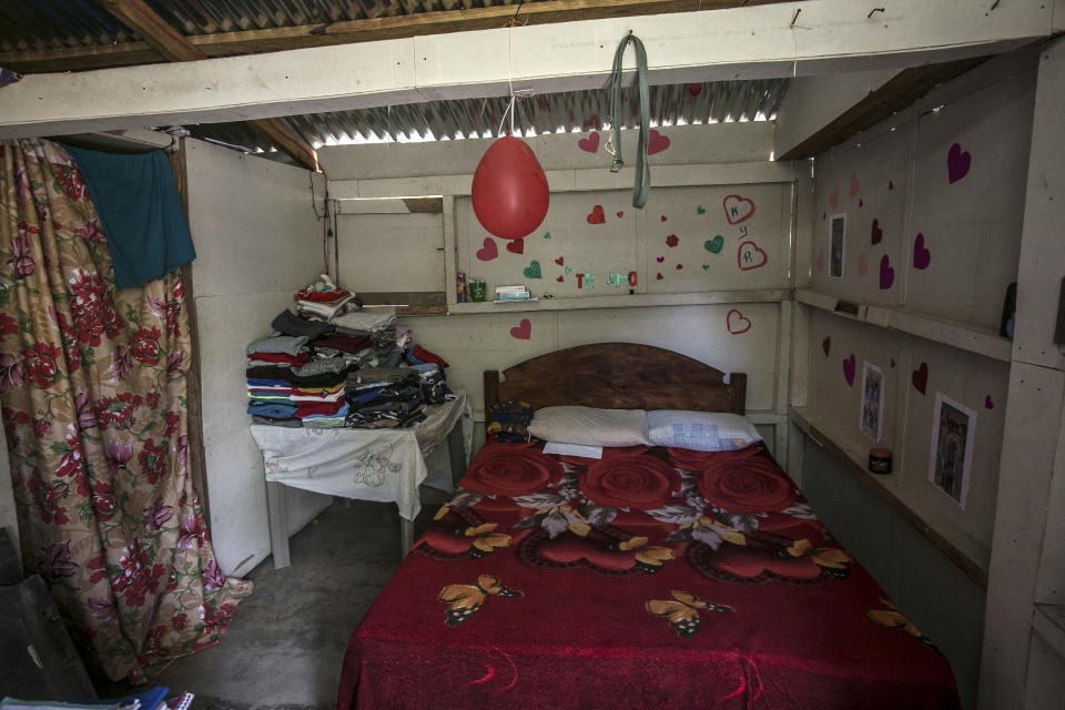 A view of the interior of the one-room home of a young woman, who said she went through her abortion here alone the previous year by taking pills, located in an unidentified mountainous area of western Honduras, Sunday, March 19, 2023. With a cellphone as her only companion for chats with a friend and an anonymous guide, the then 27-year-old became one of the women who are terminating pregnancies across the country with the help of clandestine networks. (AP Photo/Ginnette Riquelme)