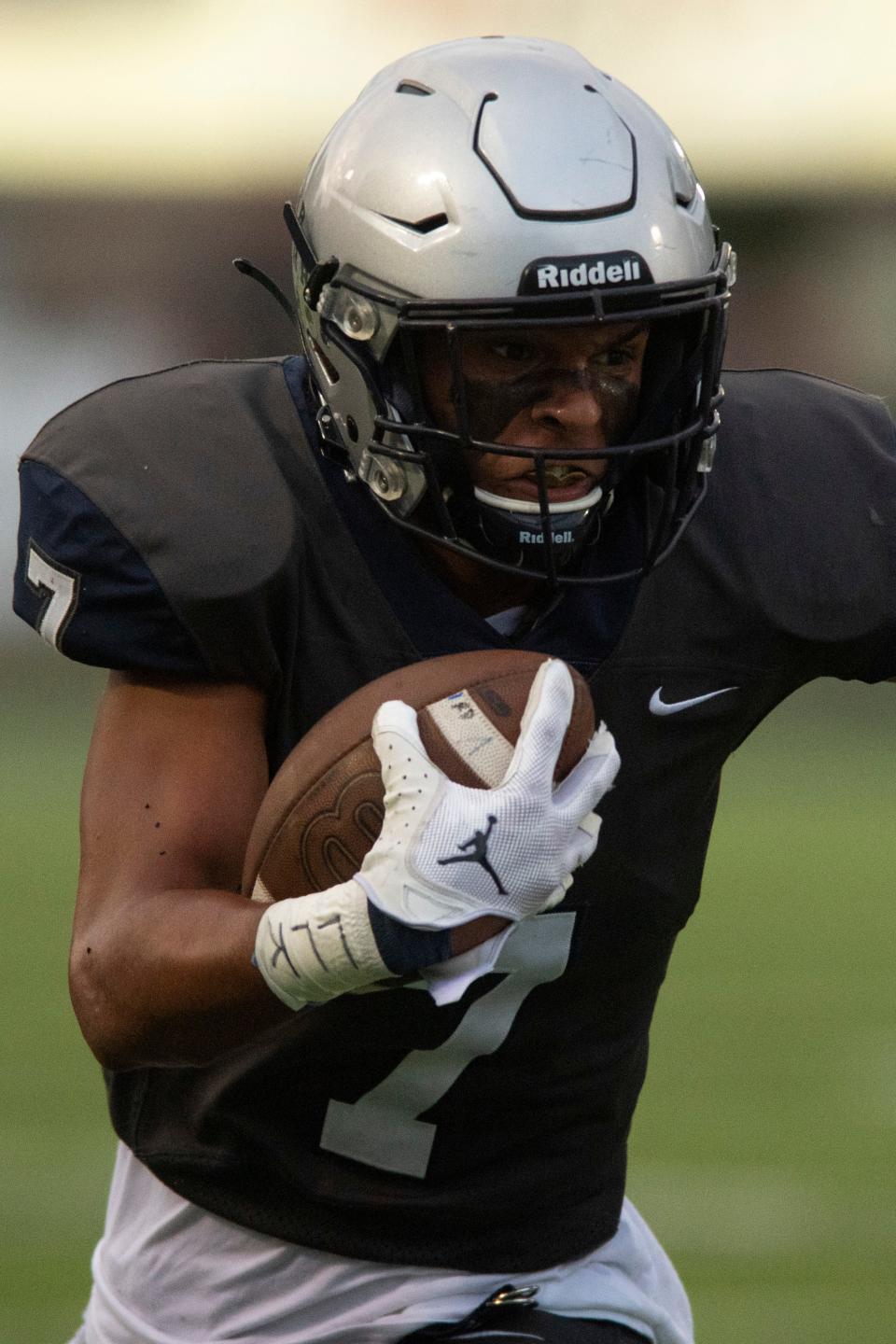 Reitz's Hayden Summers (7) carries the ball as the Reitz Panthers play the Jasper Wildcats at the Reitz Bowl in Evansville, Ind., Friday evening, Sept. 2, 2022. 