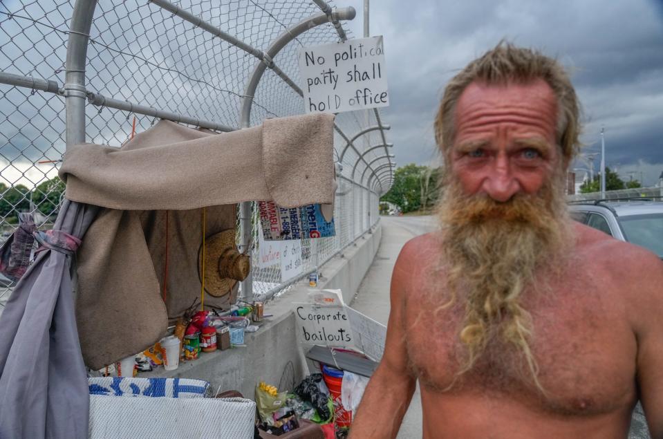 Michael Neugent at his encampment in Providence on the Orms Street I-95 overpass before he was arrested for trespassing and his belongings removed and discarded.