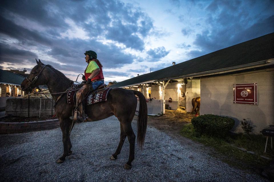 Moni Hawkins waits to lead Kentucky Derby hopeful Cyberknife to the track at Churchill Downs for a morning gallop. April 25, 2022