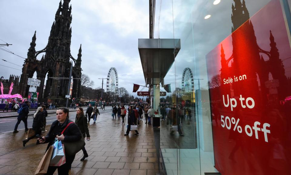 <span>Christmas shoppers on Princes Street, Edinburgh – 2023 was a disappointing Christmas for retailers. </span><span>Photograph: Murdo MacLeod/The Guardian</span>