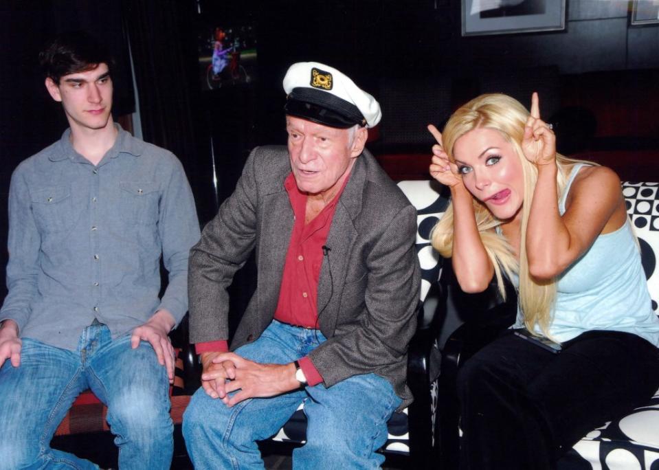 Marston Hefner with his dad and stepmother Crystal Harris, who married Hef in 2012. Marston, in the podcast, referred to her as a “master manipulator.” HMH Foundation/MEGA