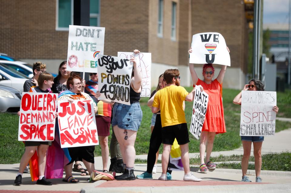 More than a dozen people took part in a protest outside Kickapoo High School on Monday, Aug. 22, 2022, after the Kickapoo principal told "a handful" of teachers last week to remove Pride flags from their classrooms, citing a school board policy.