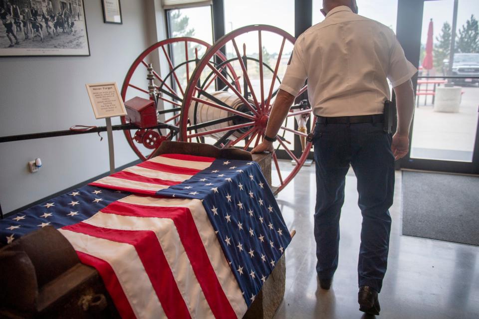 Poudre Fire Authority Support Division Chief Rick Vander Velde touches a beam from one of the World Trade Center, Wednesday, Sept. 4, 2021, on display at the Poudre Fire Authority Training and Education Center in Fort Collins.