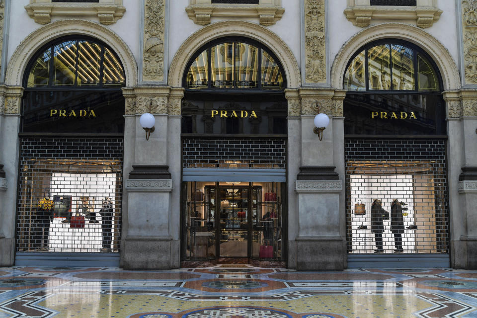FILE - The Prada store is shut down because of lockdown measures, at the Vittorio Emanuele shopping arcade in Milan, Italy, on Nov. 6, 2020. Luxury spending is growing faster than ever, fueled by pent-up pandemic demand and shifting demographics as younger, more diverse consumers buy into tiny handbag and post-streetwear trends, according to a new study by Bain consultancy released on Tuesday, Nov. 15, 2022. (Gian Mattia D'Alberto/LaPresse via AP, File)