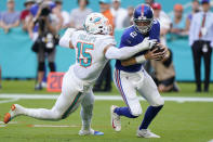 Miami Dolphins outside linebacker Jaelan Phillips (15) sacks New York Giants quarterback Mike Glennon (2) during the second half of an NFL football game, Sunday, Dec. 5, 2021, in Miami Gardens, Fla. (AP Photo/Wilfredo Lee)