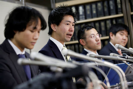 Lawyers representing a group of seven people who had invested in digital money at Coincheck, attend a news conference after they filed a suit at the Tokyo District Court, in Tokyo, Japan, February 15, 2018. REUTERS/Toru Hanai