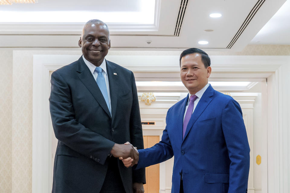 In this photo released by Agence Kampuchea Press (AKP), U.S. Defense Secretary Lloyd Austin, left, shakes hands with Cambodian Prime Minister Hun Manet in Phnom Penh, Cambodia, Tuesday, June 4, 2024. Austin traveled to Cambodia on Tuesday to push for stronger military ties with China’s closest ally in Southeast Asia. (AKP via AP)