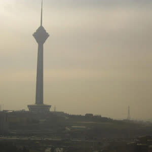 Mountain ranges behind Milad Tower in Tehran are occluded by a thick pall of smog on January 2, 2013. Credit: Neda Afsarmanesh