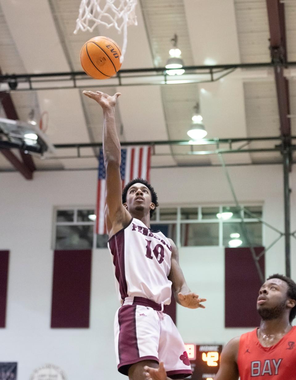 Caleb Young (10) shoots during the Bay H.S. vs Pensacola H.S. boys basketball game at Pnesacola High School in Pensacola on Wednesday, Jan. 12, 2022.