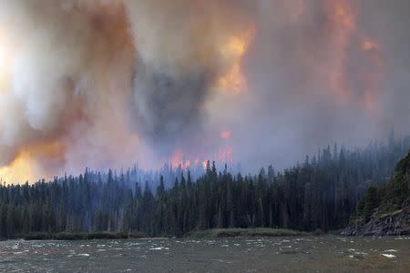 The Reynolds Creek Wildland Fire burns in Glacier National Park, Montana in this photo taken July 21, 2015. REUTERS/Erin Conwell