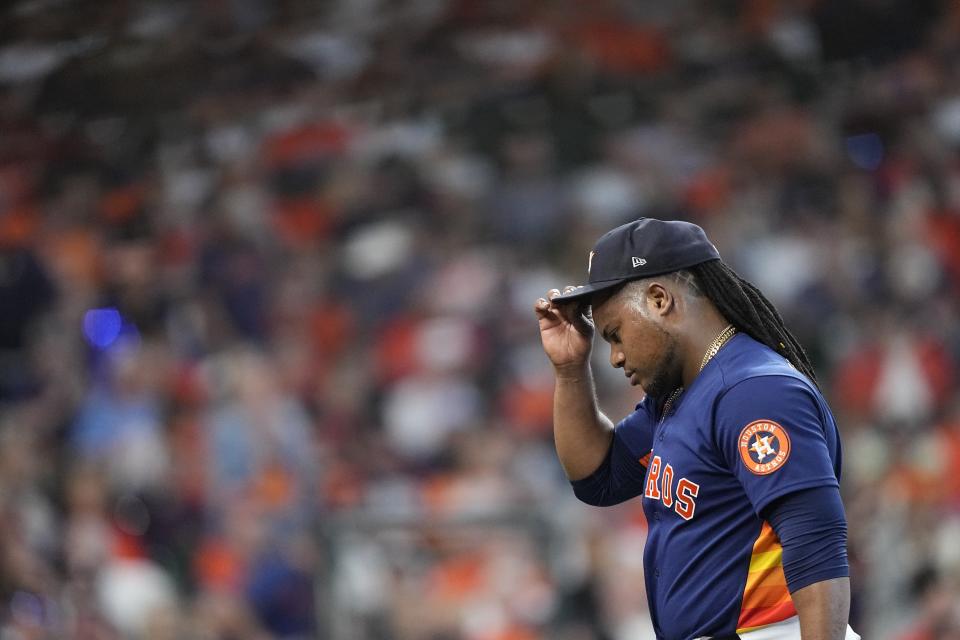 Houston Astros starting pitcher Framber Valdez reacts as he is pulled from the game during the third inning of Game 2 of the baseball AL Championship Series against the Texas Rangers Monday, Oct. 16, 2023, in Houston. (AP Photo/David J. Phillip)