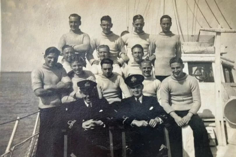 Cyril Horry (centre, front row) on board a motor torpedo boat with crew on VE Day (May 8, 1945)