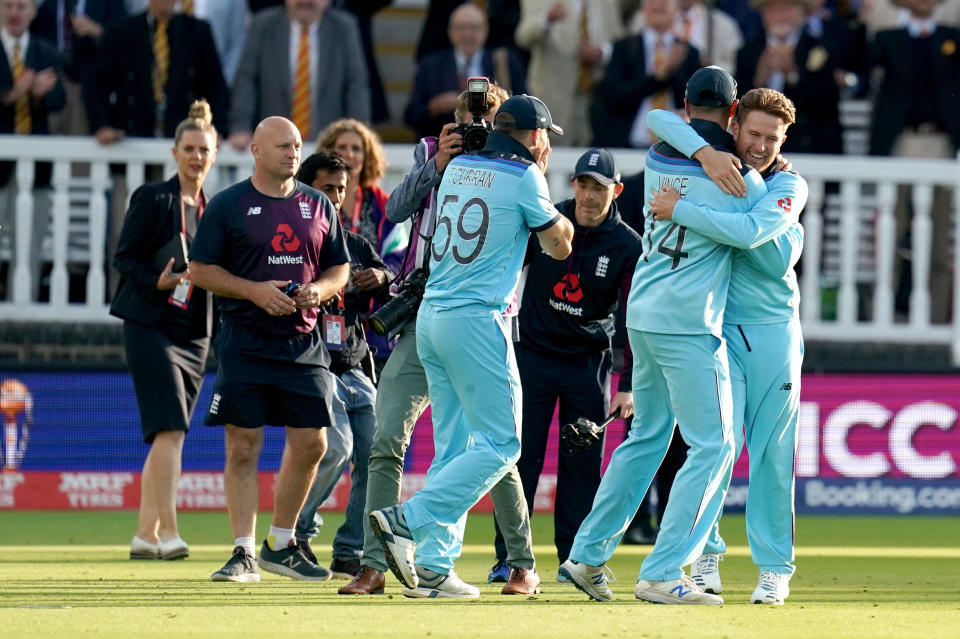 England players celebrate on the pitch after winning the ICC World Cup Final at Lord's, London.