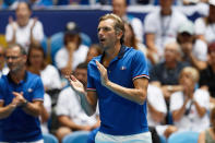 French captain Julien Benneteu cheers on his player Caroline Garcia in her match against Australia's Ash Barty during their Fed Cup tennis final in Perth, Australia, Saturday, Nov. 9, 2019. (AP Photo/Trevor Collens)