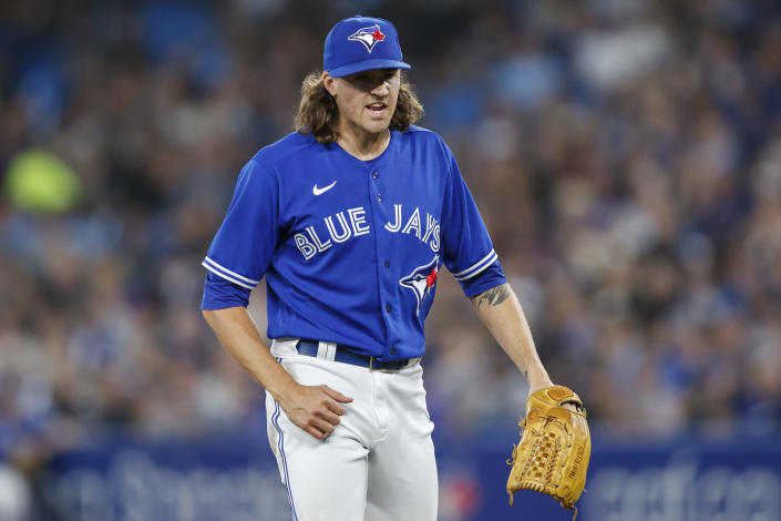 Toronto Blue Jays starting pitcher Kevin Gausman reacts after getting a strikeout to end the top of the sixth inning of baseball game action against the New York Yankees in Toronto, Monday, Sept. 26, 2022. (Cole Burston/The Canadian Press via AP)
