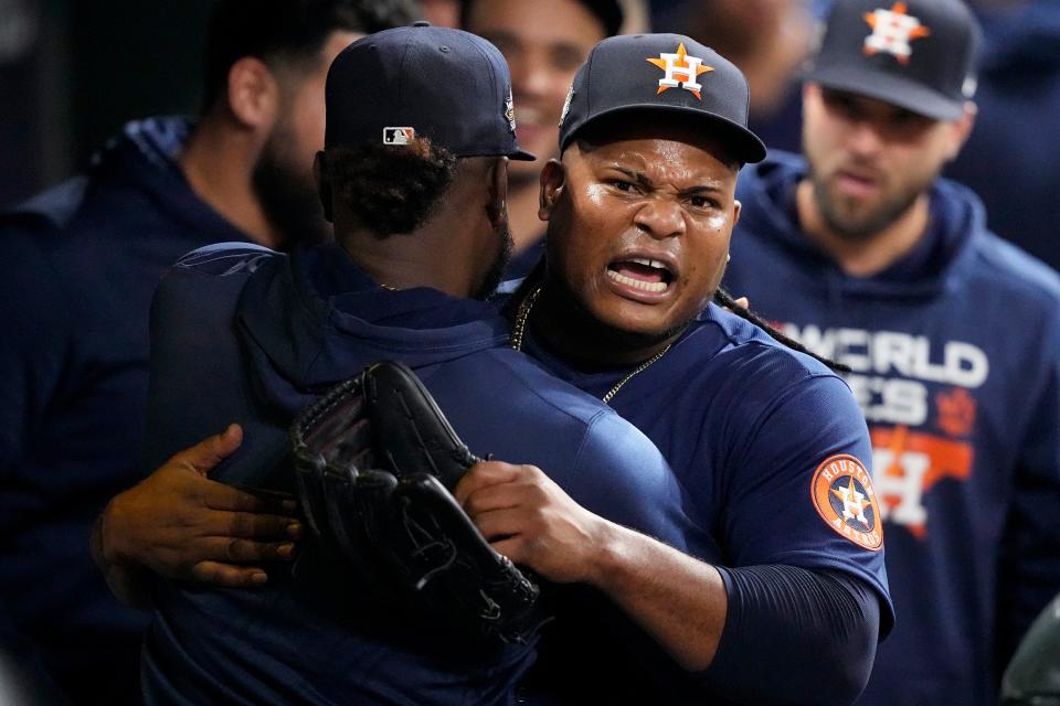 Framber Valdez celebrates in the dugout after coming out of the game in the seventh inning.