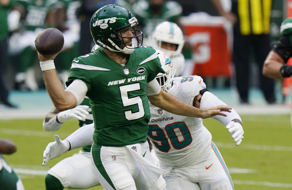 Miami Dolphins defensive end Shaq Lawson (90) goes after New York Jets quarterback Joe Flacco (5), during the first half of an NFL football game, Sunday, Oct. 18, 2020, in Miami Gardens, Fla. (AP Photo/Wilfredo Lee)