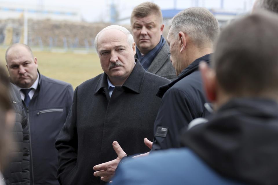 Belarus President Alexander Lukashenko speaks to workers during his visit to the Dobrush Paper Mill "Geroy Truda" in Dobrush, Belarus, Friday, Oct. 29, 2021. (Maxim Guchek/BelTA Pool Photo via AP)