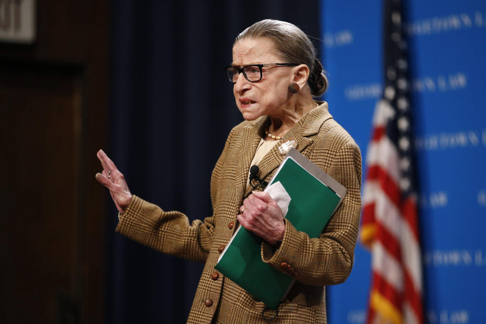 U.S. Supreme Court Associate Justice Ruth Bader Ginsburg acknowledges the crowd as she arrives to speak at a discussion on the 100th anniversary of the ratification of the 19th Amendment at Georgetown University Law Center in Washington, Monday, Feb. 10, 2020. (AP Photo/Patrick Semansky)