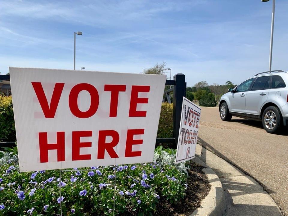 Voting signs sit outside of the Word of Life Church in Flowood, Miss., Tuesday morning. The polling location houses Precinct 215 which consists of 3,399 registered voters.