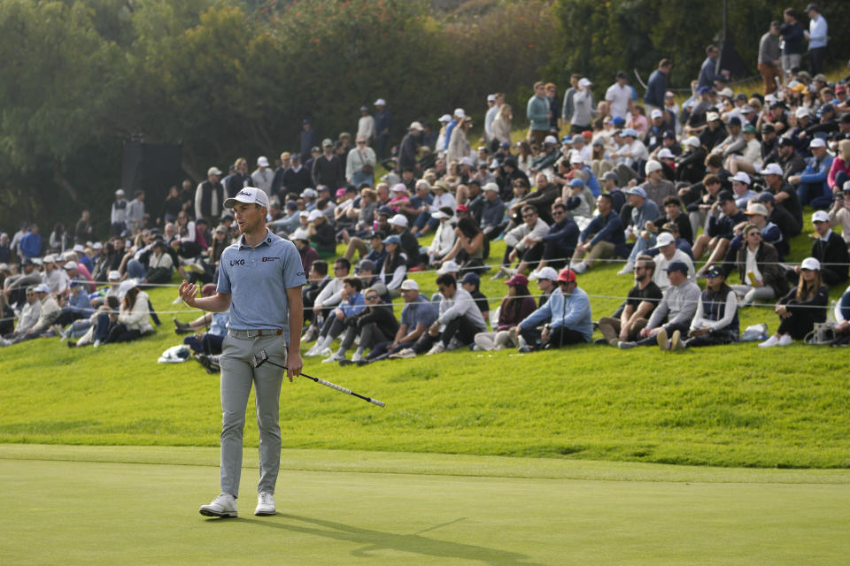 Will Zalatoris follows his putt on the 18th green during the third round of the Genesis Invitational golf tournament at Riviera Country Club, Saturday, Feb. 17, 2024, in the Pacific Palisades area of Los Angeles. (AP Photo/Ryan Sun)