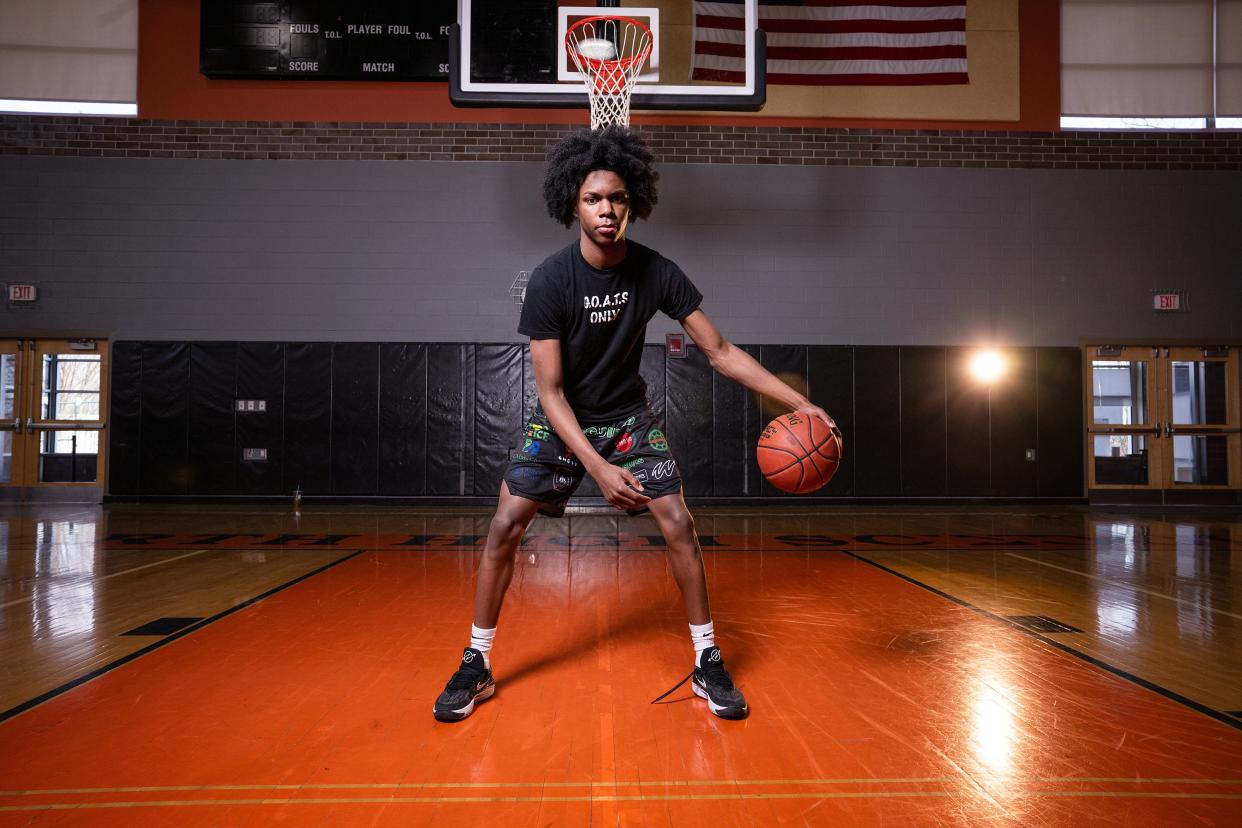 North High junior starter Amir Jekins dribbles for a portrait on Tuesday February 27, 2024.