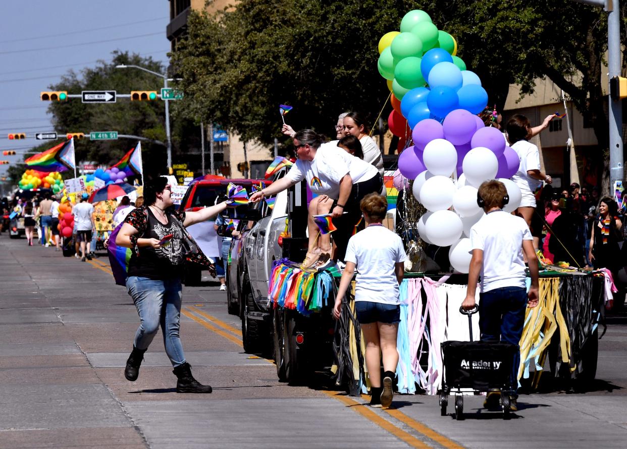 Colorful outfits, colorful language color first Pride Parade in Abilene