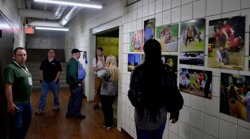 People tour the inside of the former Herald-Mail building on Summit Avenue Wednesday during an open house ahead of an auction of the building next week.
