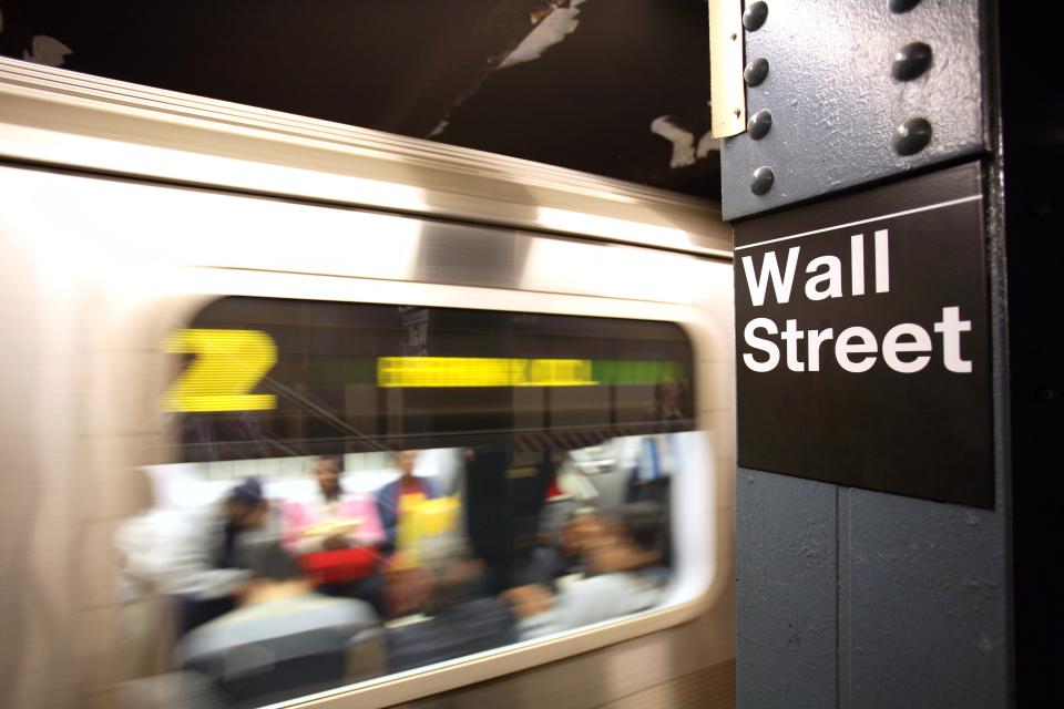 Wall Street sign on the subway