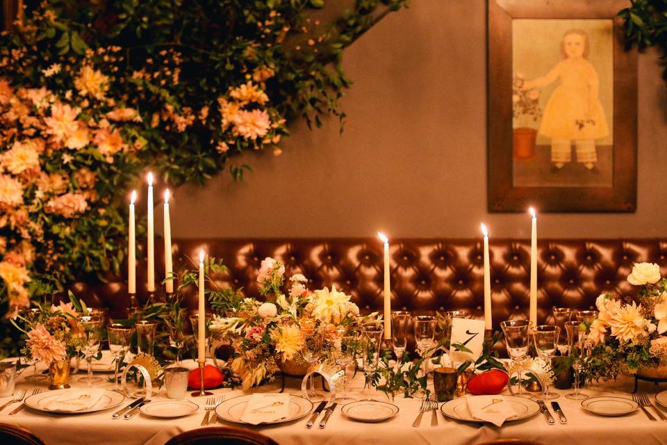 For the tables, we incorporated antique candlesticks in different shapes and gold animal table card holders. You might be able to spot the elephant on this one.