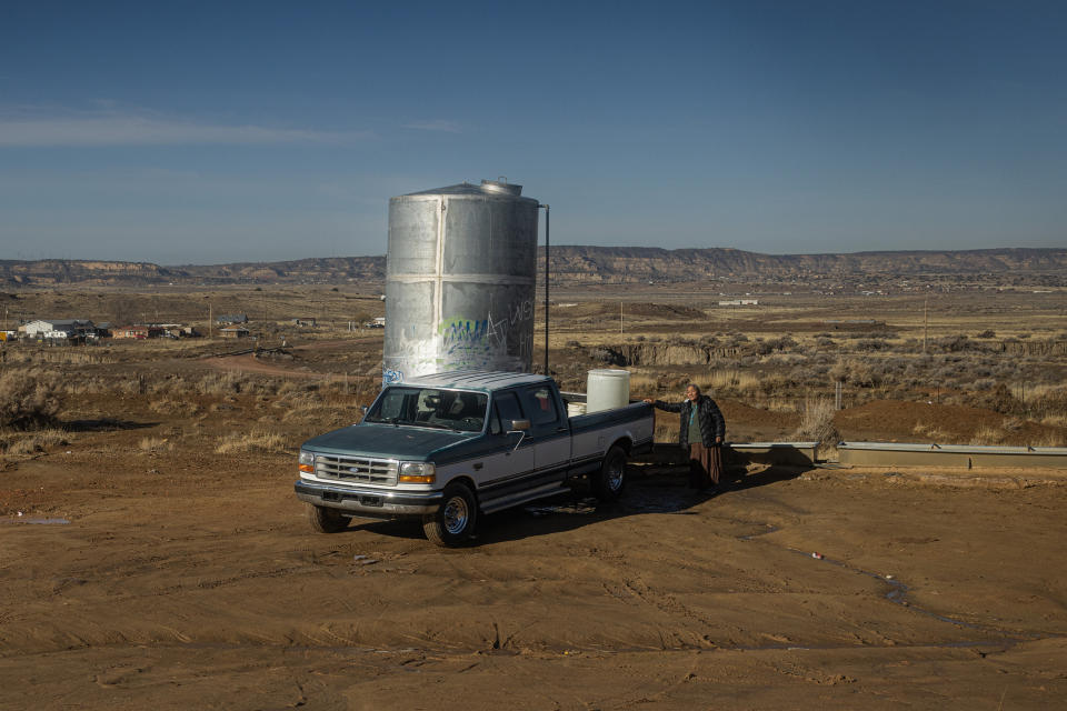 Marilyn Help-Hood hauls water  in Tohlakai, N.M. (Sharon Chischilly for NBC News)