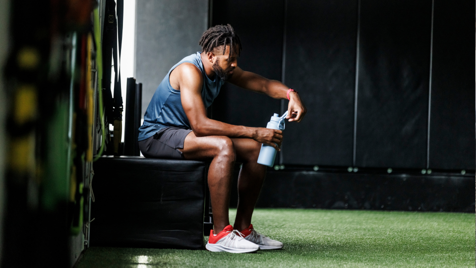 what is a deload week: man having a rest in the gym