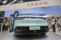 Visitors look at a Zeekr Mix car during the China Auto Show in Beijing, China, Friday, April 26, 2024. China's vision of the future of the automobile electrified and digitally connected is on display at the ongoing Beijing auto show. (AP Photo/Tatan Syuflana)