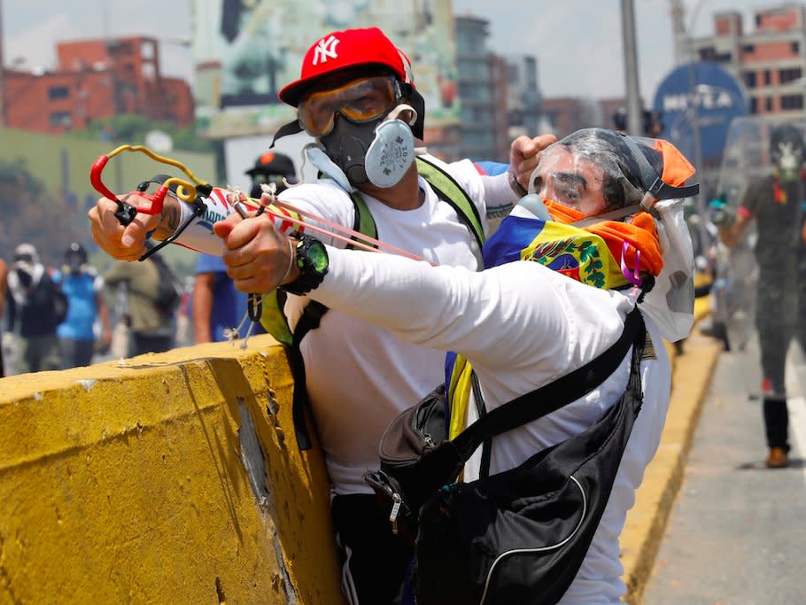 Opposition supporters clash with security forces during a rally against Venezuela's President Nicolas Maduro in Caracas, Venezuela April 26, 2017.