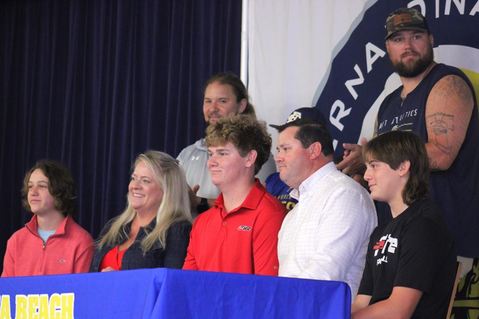 Surrounded by his family, Fernandina Beach football lineman Nolan Blackard smiles after signing with Southeastern University during a college athletic signing ceremony on May 1, 2024. [Clayton Freeman/Florida Times-Union]