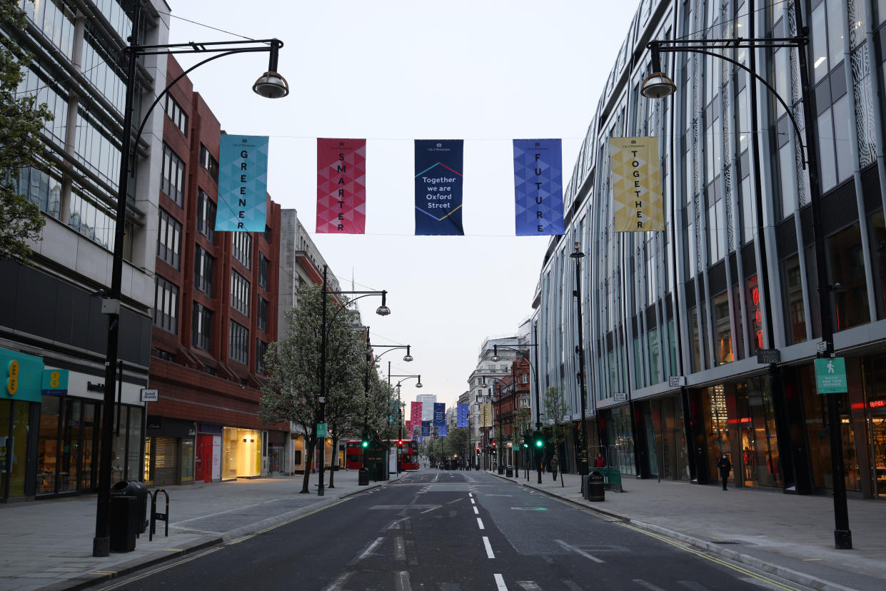 LONDON, ENGLAND - APRIL 12: A general view of a quiet Oxford Street before the shops reopen today as coronavirus restrictions ease on April 12, 2021 in London, United Kingdom. England has taken a significant step in easing its lockdown restrictions, with non-essential retail, beauty services, gyms and outdoor entertainment venues among the businesses given the green light to re-open with coronavirus precautions in place. Pubs and restaurants are also allowed open their outdoor areas, with no requirements for patrons to order food when buying alcoholic drinks.  (Photo by Dan Kitwood/Getty Images)